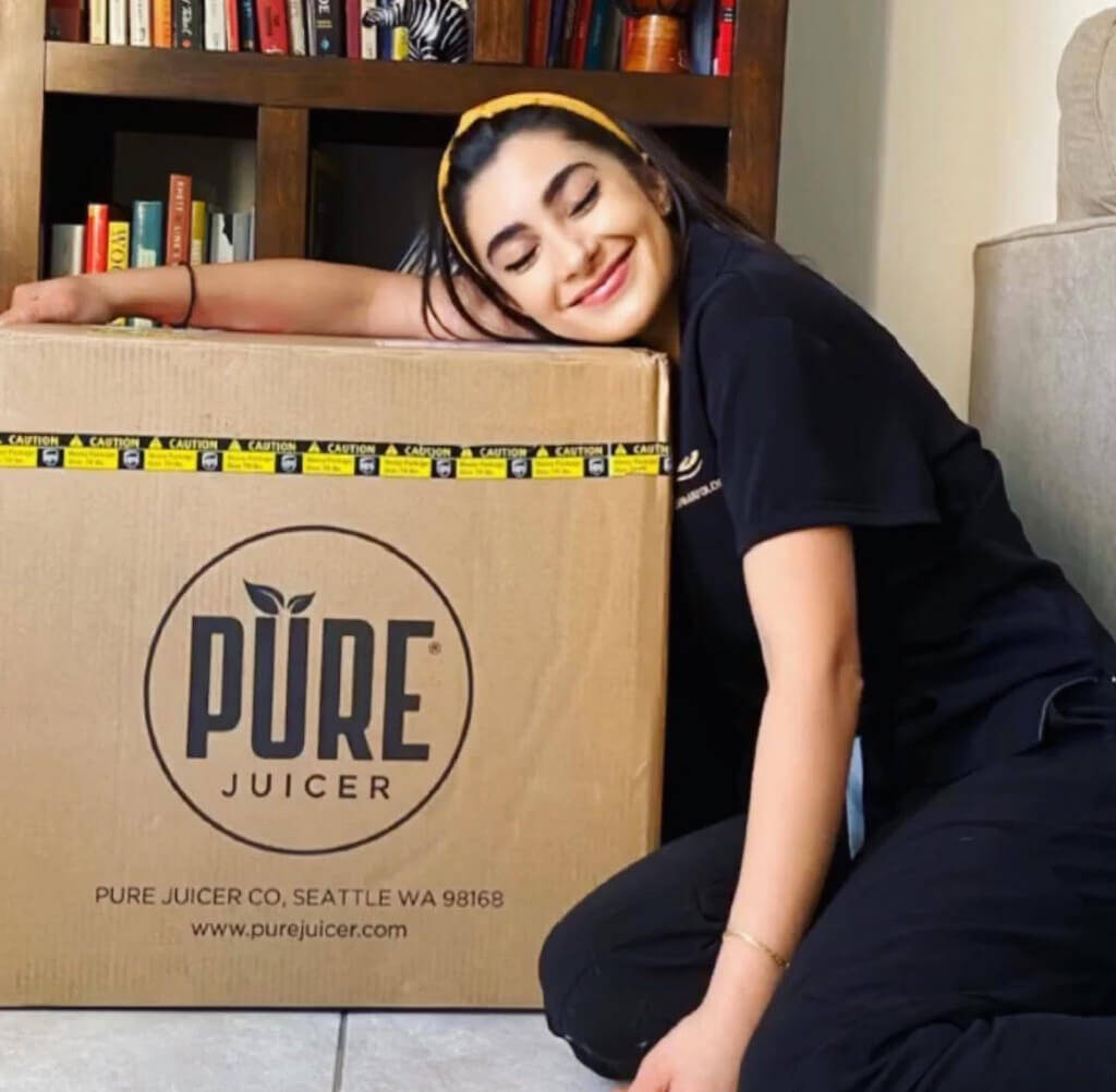 Ana Celia with PURE Juicer box