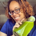 Kia Sanders holding green juice