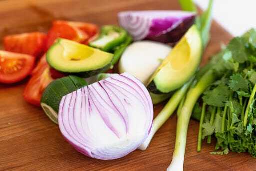 fresh veggies cut (onion, avocado, tomato)