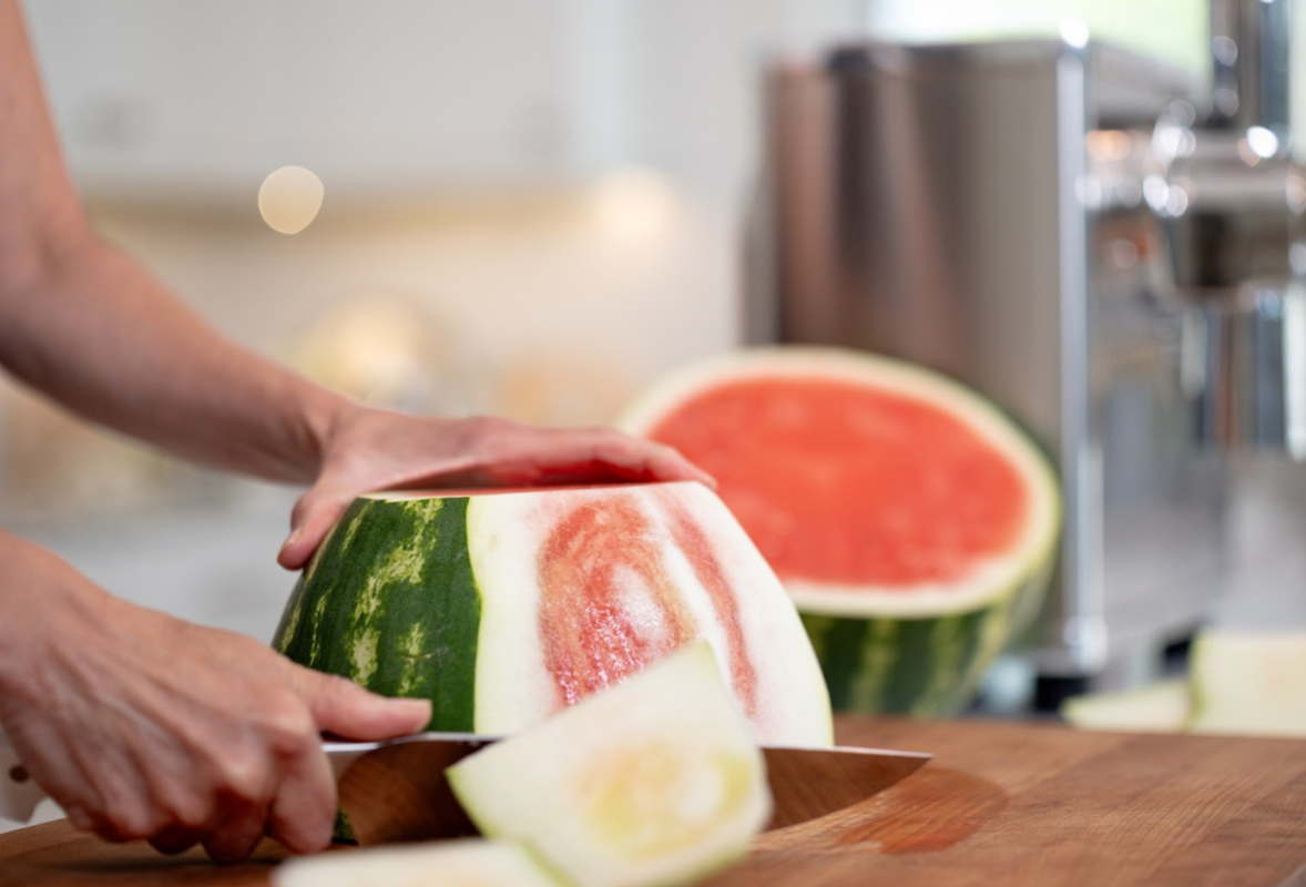 Slicing watermelon to put into PURE Juicer